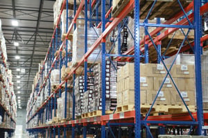 Warehouse facility interior displaying an aisle of racking