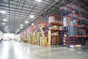 Interior of a warehouse facility displaying several rows of pallet racking