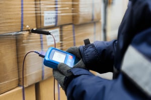 Person Checking the Temperature of Products in Cold Storage - Smart Warehousing